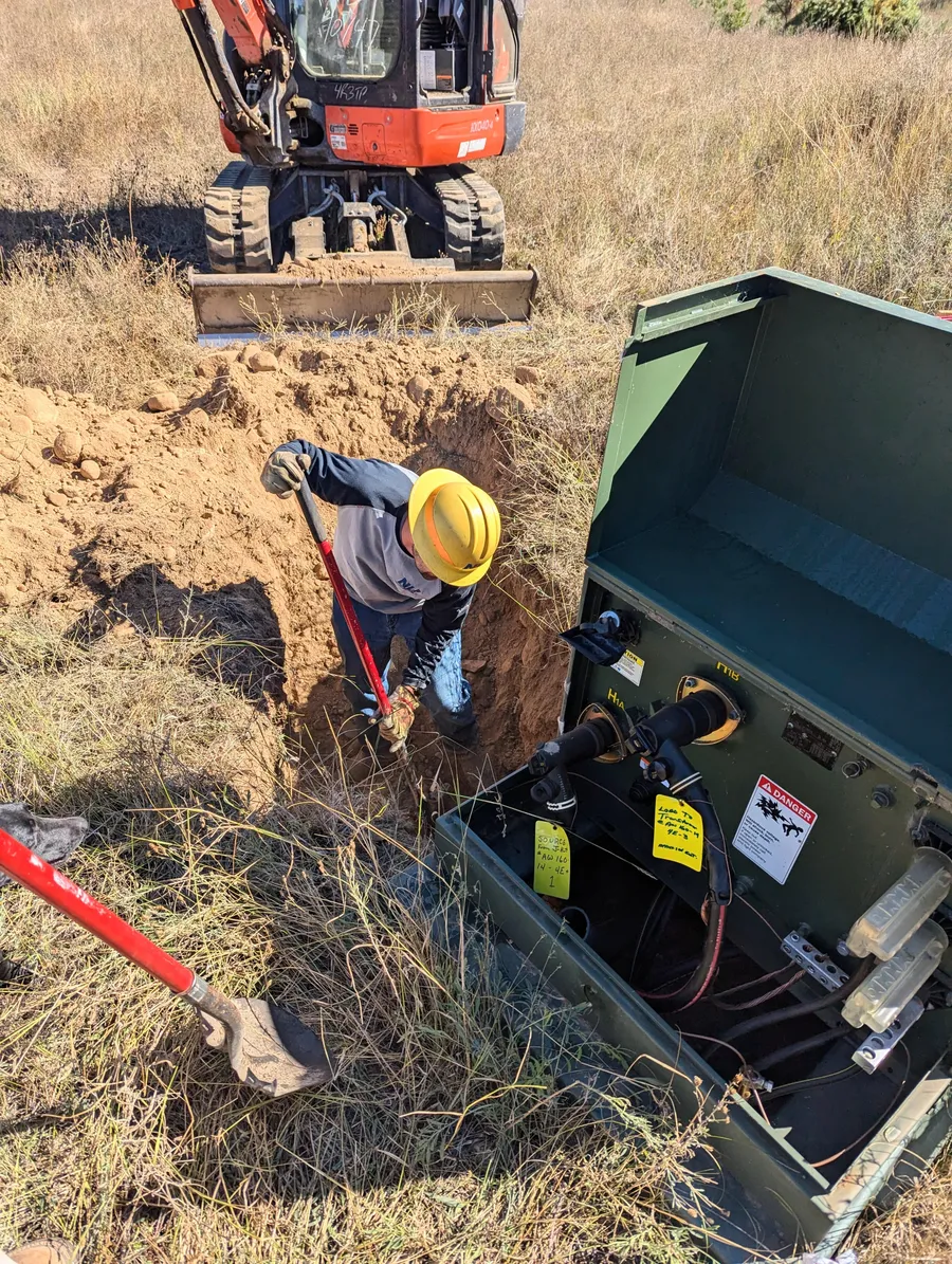 Excavator digging a trench