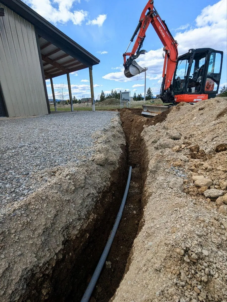 Looking up at excavator during trenching
