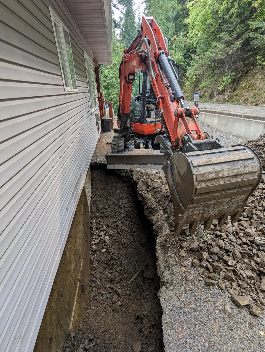 Trenching on a lakehouse hillside