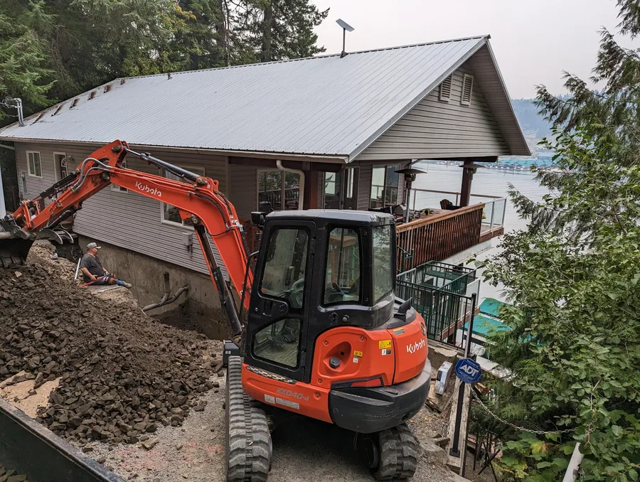 Trenching beside a lakehouse