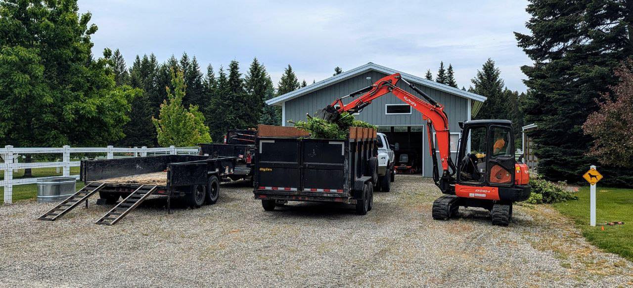 Excavator working on a residential North Idaho property